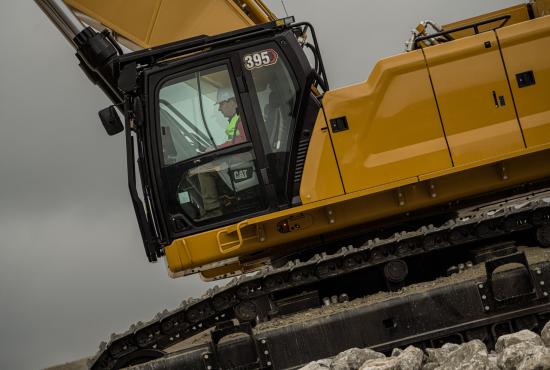 The 395 hydraulic excavator's all-new cab keeps operators comfortable and productive.