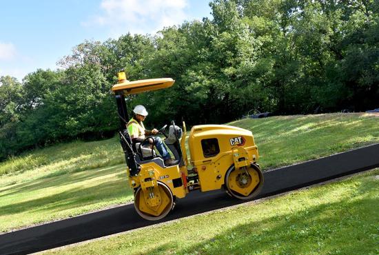CB2.5 GC tandem roller compacting asphalt on a footpath CB2.5 GC tandem roller compacting asphalt on a footpath